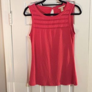 Coral sleeveless top.